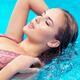 Beautiful woman lying in water closeup of face... (thumbnail)