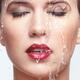 Water pouring over beautiful woman face with waterproof makeup and lip... (thumbnail)