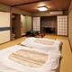 Futons at traditional Japanese room at a ryokan... (thumbnail)