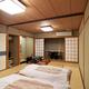 Traditional Japanese room at ryokan with futons... (thumbnail)