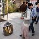 Japanese woman at Jishu Jinja shrine walking towards love rock at Kiyo... (thumbnail)