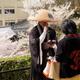 Mendicant Buddhist monk accepting donations... (thumbnail)