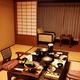 Dinner served on table at Japanese ryokan hotel room... (thumbnail)