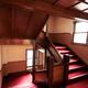 Antique wooden stairs with red carpet... (thumbnail)