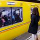 Woman at subway platform waiting for train... (thumbnail)