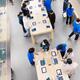 People at Apple store trying new products... (thumbnail)