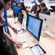 People at Apple store trying new computers... (thumbnail)