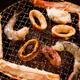 Closeup of seafood on grill stove... (thumbnail)