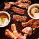 Closeup of beef and scallops grilled on fire... (thumbnail)