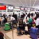 People at check-in counter at Narita airport in Japan... (thumbnail)