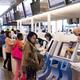People at check-in counter at Narita international airport... (thumbnail)