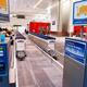 Luggage carts at an airport... (thumbnail)