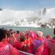 People in pink raincoats on boat ride at Niagara Falls... (thumbnail)