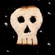Skull made of bread on black... (thumbnail)