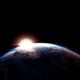 Sun rising from behind planet Earth outline... (thumbnail)