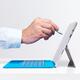 Hand with a pen touching display of Microsoft tablet Surface Pro 3... (thumbnail)