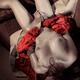 Seductive nude woman with tied hands in red... (thumbnail)