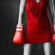 Woman in sexy red dress wearing boxing gloves... (thumbnail)
