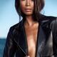 Sexy young woman in black leather jacket on shiny bare skin... (thumbnail)