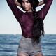 Young fashionably dressed woman at the beach... (thumbnail)