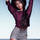 Young fashionably dressed woman in shorts at the beach... (thumbnail)