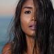 Young woman with long wet hair covering her face... (thumbnail)