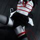 Woman lying down tied with red bondage ropes... (thumbnail)