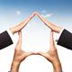 Conceptual home symbol made by hands over blue sky... (thumbnail)