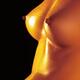 Closeup of bare woman breasts with shiny skin... (thumbnail)