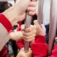 Closeup of people hands in subway... (thumbnail)