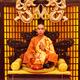 Buddhist monk meditating with wooden fish... (thumbnail)
