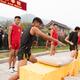 Students of Tagou Shaolin martial arts school conditioning their hands... (thumbnail)
