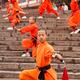 Students of Shaolin Kung Fu school performing with weapons in DengFeng... (thumbnail)