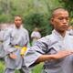 Students of Shaolin martial arts school practicing Qi Gong outside... (thumbnail)