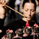 Woman lighting incense at Buddhist Temple... (thumbnail)