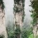 Mountain spire with trees on top of it in Zhangjiajie National Park Ch... (thumbnail)
