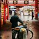 Postman in the Old city of Shanghai China... (thumbnail)