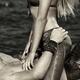 Sexy young couple making love on the beach black and white... (thumbnail)