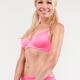 Young smiling pretty blond woman in pink sports bra... (thumbnail)