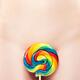 Closeup of Naked Woman Body with a Colorful Lollipop... (thumbnail)