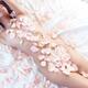 Beautiful nude asian woman lying in bed with pink rose petals on her b... (thumbnail)
