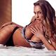 Glamour portrait of sexy young woman in lingerie lying on bed Charlie... (thumbnail)