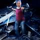Portrait of man in Kung Fu stance with sledgehammer at demolition work... (thumbnail)