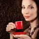 Beautiful smiling woman holding a cup of coffee... (thumbnail)