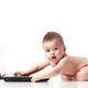 Cute surprized baby in diaper playing with computer... (thumbnail)
