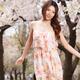 Young happy asian woman at a park with chery blossom in spring... (thumbnail)