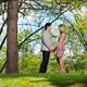 Young couple holding hands in a park... (thumbnail)