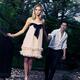 Young woman leading a man behind... (thumbnail)