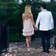 Young Couple Walking in a Park Holding Hands... (thumbnail)