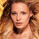 Beauty portrait of a woman with glowing golden blond hair... (thumbnail)